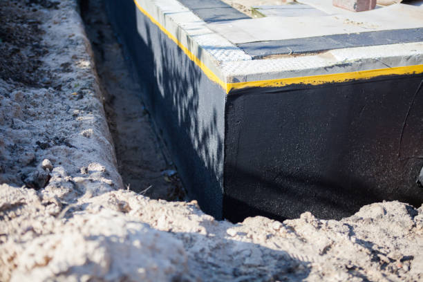 Professional Exterior Waterproofing technician working in Walton, KY